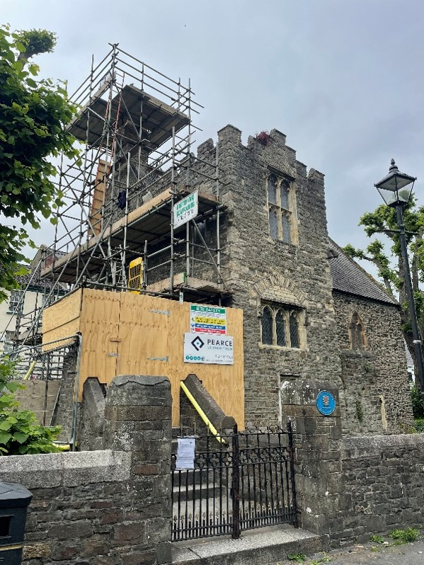 A photo of St Anne's Chapel with scaffolding and hoarding