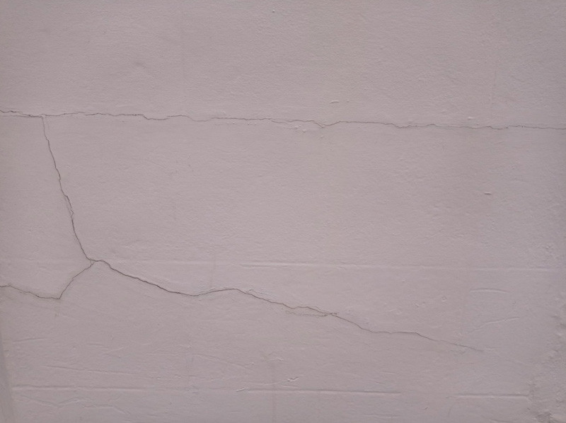 Hairline cracks in a block wall