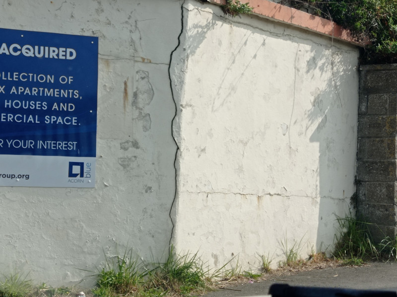 A leaning wall with a large crack