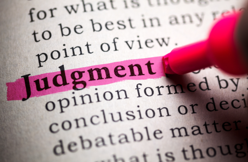 Image showing the word judgement in a dictionary being highlighted